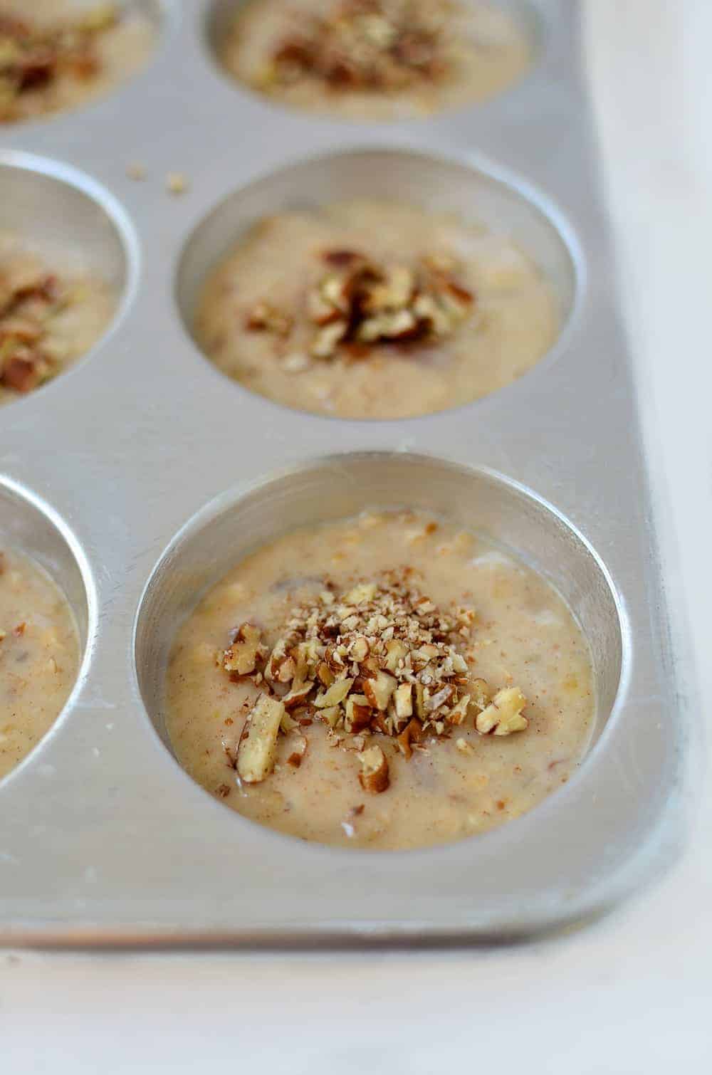 Healthy Banana Pecan Muffins! You are going to love these fluffy, moist muffins! Perfect for an afterschool snack or breakfast. | www.delishknowledge.com